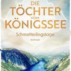 Text: "Martina Sahler, Die Töchter vom Königssee, Schmetterlingstage, Roman." Illustration eines Sees zwischen grünen Bergen.