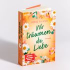 Bucheinbandtext: "Wir träumen die Liebe", von Josie Silver. Vorderseite mit Blumendesign, hauptsächlich Margeriten.