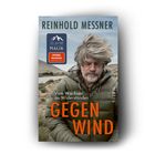 "REINHOLD MESSNER", "Vom Wachsen an Widerständen", "GEGEN WIND". Mann mit grauen Haaren in Jacke vor Landschaft.