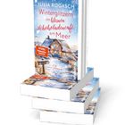 "Winterglitzern im kleinen Schokoladencafé am Meer" von Julia Rogasch. Cover zeigt ein verschneites Café an der Küste.