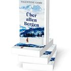 Der Text auf dem Buch lautet: "Valentine Goby, Über allen Bergen, Roman". Ein gemaltes Bergmotiv schmückt das Cover.