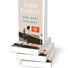 Der Text lautet: "Tom Saller," "UND HEDI SPRINGT." Zusätzlich ist ein "SPIEGEL Bestseller-Autor"-Sticker sichtbar. Es zeigt einen Mann und ein Mädchen, das von einer Mauer springt. Mehrere gestapelte Bücher.