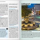 Seite 22: "Iràklio und sein Hinterland". Seite 23: "Lieblingsort". Ein Brunnen auf einem belebten Platz bei Nacht.