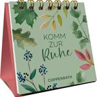 "Kommt zur Ruhe" in grüner Schrift auf einem Tischkalender mit bunten Blättern verziert.