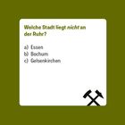 "Welche Stadt liegt nicht an der Ruhr? a) Essen b) Bochum c) Gelsenkirchen." Unten rechts: Bergbau-Symbol.