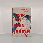 Text: Jessica Stanley, WIR IN ZEHN JAHREN. Abbildung: Zwei gezeichnete Personen, einer hebt die Hand zum Gesicht.