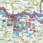 Kartenabschnitt mit nummerierten Kästchen in Rot, Schwarz und Blau entlang einer Grenze; Ortsnamen sind verteilt.