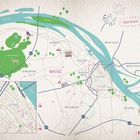 Eine gezeichnete Karte von Mainz mit Viertelnamen und Straßen, umrahmt von Fluss und Grünflächen; oben rechts "Glückskarte".