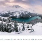 Im unteren Bereich stehen die Zahlen 1 bis 31. Die Landschaft zeigt einen verschneiten Bergsee vor einer Gebirgskette.