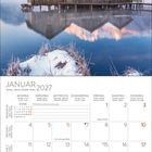 Januar 2027 Kalender mit einer verschneiten Landschaft und Bergen im Hintergrund.