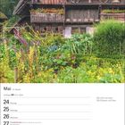 Mai, 21. Woche, Zwillinge: 21.5.–20.6. "Mai kühl und nass füllt Scheuer und Fass." Ein rustikales Haus mit üppigem Garten.