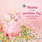 „Heute ist der perfekte Tag, um mit Konfetti zu werfen.“ Ein rosa Schwein umgeben von buntem Konfetti.