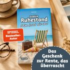 Buchtitel „Endlich Ruhestand“, Brille und Kaffee auf Tisch, dunkle Umrandung: "Das Geschenk zur Rente, das überrascht".
