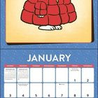 Ein Kalenderblatt für Januar. Eine Illustration zeigt einen Hund in roter Jacke und blauer Mütze.