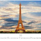 Paris, Eiffelturm; Monat 10; Zahlenreihe 1-31. Der Eiffelturm vor einem teils bewölkten Himmel bei Sonnenuntergang.