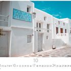 Anima Mykonos; Mykonos; Casares Edition; weiß getünchte Gebäude mit blauen Türen und Fenstern unter einem blauen Himmel.