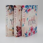 Drei Bücher mit floralen Covern. Titel: "unwritten LOVE", "unplayed LOVE", "untold LOVE" von Teresa Sporrer.