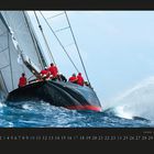 10. Segelboot „Rainbow“ mit Crew in roten Jacken im Wettkampf auf stürmischer See. Kalenderdarstellung.