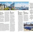 "Restaurants: Dock 3 Beachclub, Blockbräu, Watergate. Perfekte Aussicht bei einer Fahrt mit der Hafen-Hochbahn. Foto: Flussschifferkirche." Häuser, Schiffe, Kirchturm, moderner Bau im Hintergrund.