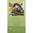 Text über einem alten Wasserrad: "Wie ein altes Wasserrad, vom Strom bewegt... ein Geschenk Gottes in meinem Leben." Darunter Kalender für Oktober.