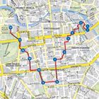 Karte von Berlin mit Nummern 1-14, die eine rote Route markieren. U- und S-Bahn-Stationen sind grün und blau markiert.