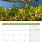 Kalender für Oktober 2027 mit herbstlicher Landschaft oberhalb und Weinstöcken im Vordergrund.