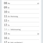 Kalenderblatt für November mit Feiertagen. Ein Siamkätzchen mit blauen Augen liegt kuschelig in einem Korb.
