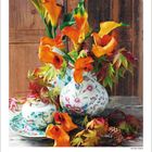 Kalenderblatt für November 2027, dekoriert mit orangefarbenen Blumen in einer gemusterten Vase auf einem Holztisch.