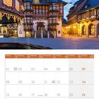 Kalender für November 2027. Bild zeigt ein historisches Rathaus mit spitzen Türmen in Abendbeleuchtung.