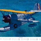 "November", Kalender mit Grumman J2F-6 Flugzeug über blauem Wasser; gelber Flügel und Text "Candy Clipper" sichtbar.
