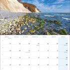 Kalenderseite November 2027. Feiertage: 1. Allerheiligen, 19. Buß- und Bettag. Oben Küstenfoto mit Klippen und Meer.