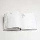 Texte: "A (8.2.2022)" und "strong winds [...] silence (16.2.2022)". Ein aufgeschlagenes Buch auf weißem Hintergrund.