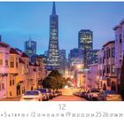 San Francisco bei Nacht. Monatsblatt "12". Abendszene mit Straßen und beleuchteten Wolkenkratzern im Hintergrund.