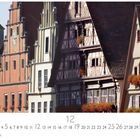 "Dinkelsbühl, Weinmarkt" steht unten. Historische Fachwerkhäuser mit bunten Fassaden und Blumenkästen an Fenstern.