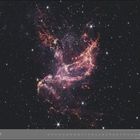 "12 | DEZEMBER" steht unten. Eine leuchtende, farbenfrohe Weltraumnebel-Illustration mit vielen funkelnden Sternen.