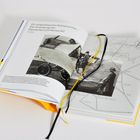 Text: "Ein luftpolitischer Kompromiss – Die Gründung der Deutsche Luft Hansa AG. 1926." Geöffnetes Buch, schwarz-weiße Fotos, Landkarte.