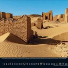 „12 2023“, darunter Wochentage und Daten. Wüstenlandschaft mit Ruinen, blauer Himmel.