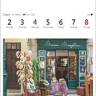 Kalender für August, Woche 31. Hutgeschäft "Maison Miraflores" in Cotignac mit Strohhut-Auslage und grünem Ladenfront.