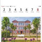 "August, 31. Woche, Hotel im Seebad Bansin auf Usedom. Bild von einer farbenfrohen Villa vor blühenden Blumen und Bäumen."