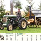 PRIMUS DEUTZ P22, Baujahr: 1938, 22 PS. Dezember 2027. Ein Mann auf einem grünen Traktor vor einem befeuerten Wagen.