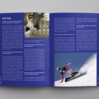 Linke Seite oben: "Julie Zogg". 
Interviewtexte über mentale Stärke und Snowboardrennen. 
Oben links: Eine Frau mit Kristallkugeln unter einem Baum. 
Unten rechts: Snowboarder in Aktion im Schnee.