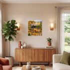 Text: "Naive Malerei 2024". Kunstkalender an der Wand über einem Sideboard in einem hellen Wohnzimmer.