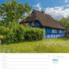 11. Woche, März 2027, Kalender mit reetgedecktem Haus in ländlicher Umgebung unter blauem Himmel.