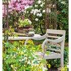 14. April, Mo 05, Di 06, Mi 07, Do 08, Fr 09, Sa 10, So 11. Blühender Garten mit Gartenbank, Rhododendren in Rosa und Weiß.