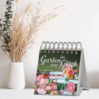 „Garten im Glück 2024“ und „Wo Blumen blühen, lächelt die Welt“. Titelbild von Blumen, mit Tulpen und Vase.