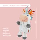 „Soziale Kompetenzen stärken“, „Trösten, zuhören und Empathie entwickeln“. Ein Plüsch-Einhorn mit buntem Horn.