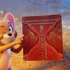 "Traveling Exhibition of the Astral Compass. Journey into the Enigmatic East." Eine animierte Maus zeigt auf ein Poster.
