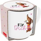 Text: "Für Dich". Illustration: Ein Hund mit gestreiftem Pulli hält eine Blume, rosa Herz über ihm. Verpackung mit bunten Punkten.