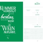 Links steht "Kummer verdaut man am besten, wenn man ihn in Wein auflöst". Rechts eine Seite zum Notieren von Rezepten.
