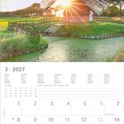 Kalender für März 2027, mit Feiertagen. Im Hintergrund eine Windmühle bei Sonnenuntergang in einer ländlichen Landschaft.